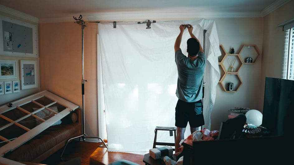  Guy setting up a YouTube backdrop