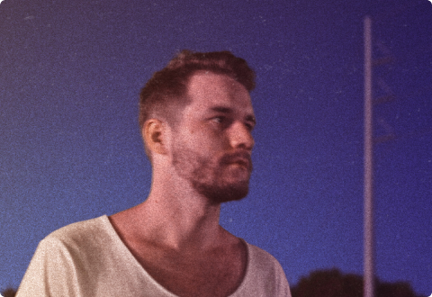 A Soundstripe artist with music available for sync licensing gazes into a clear evening sky.