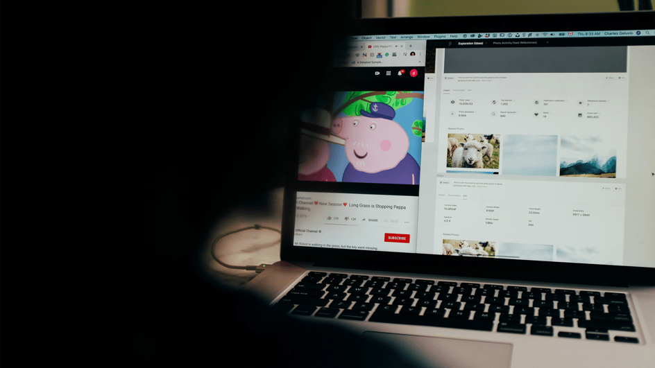  Person at laptop, working on YouTube algorithm updates for 2024